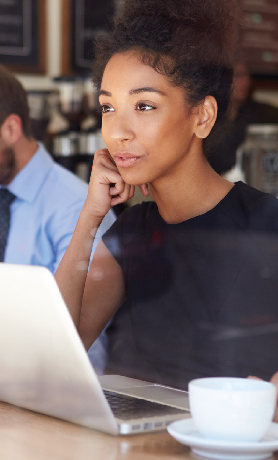 Asian woman at coffee shop with laptop